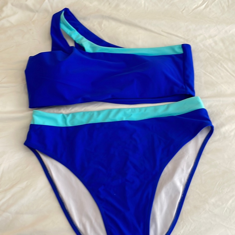 Cute high waisted one shoulder swim. Worn once runs a little smaller.